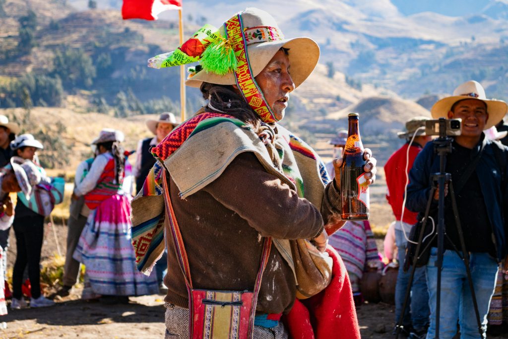 Colorful Andean festival scene in Caylloma, capturing traditional attire and cultural celebration.